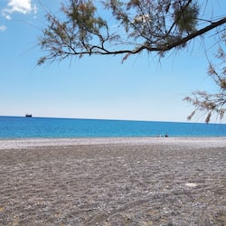 On the beach, black sand