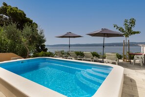 Outdoor pool, a heated pool - Villa on the beach with private pool (Mimice)