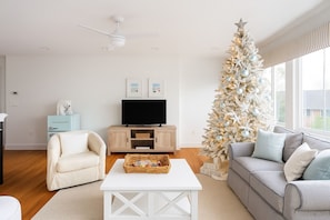 TV, fireplace, books - Luxury 8BR Winter Wonderland • Sleeps 22 • Indoor Fireplaces & Ocean Views (New London)