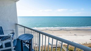A balcony with a view of a beach and ocean. - New High Floor, Direct Sea Watch, King Bed, Decor! (Myrtle Beach)