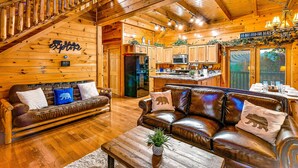 A wooden cabin interior with a living room, kitchen, and dining area. - 🏔🏔 180° Views 🏔🏔 ❸Decks ❸Masters ❷Game R♨Hot T (Sevierville)