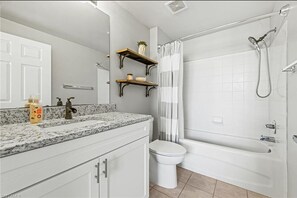 Combined shower/bathtub, hair dryer, towels, soap