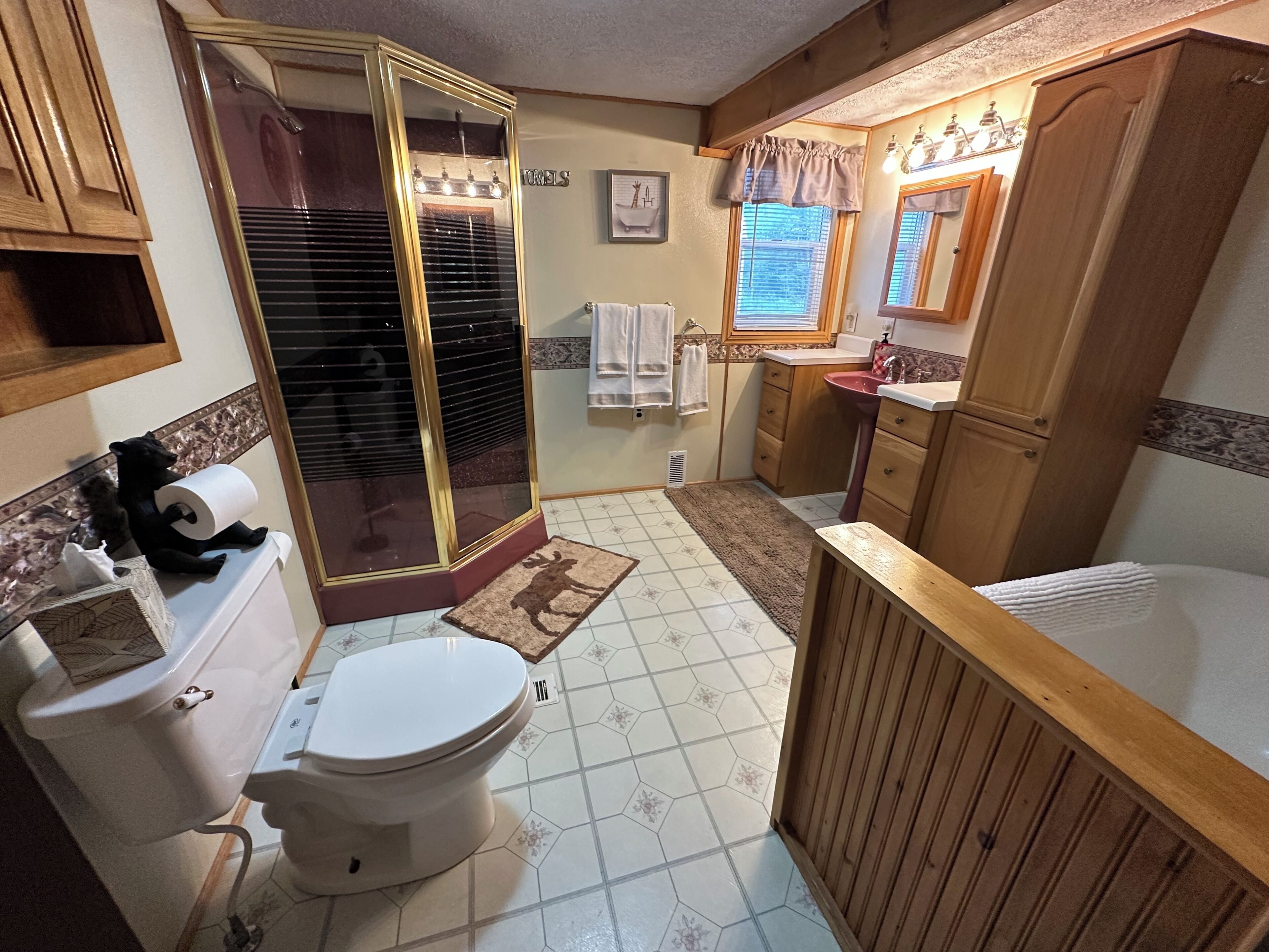Bathtub, hair dryer, towels, soap