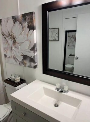 Bathtub, hair dryer, towels, soap