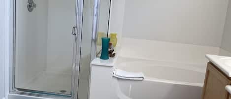 Combined shower/bathtub, hair dryer, towels, toilet paper