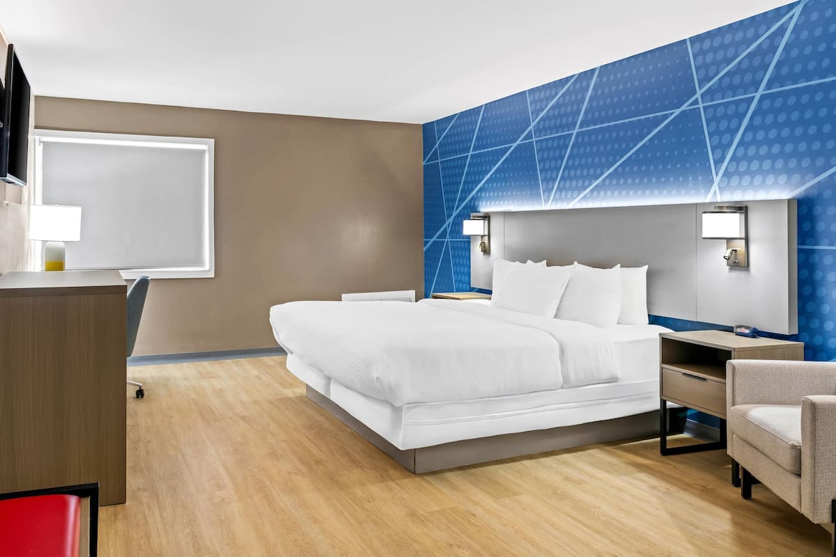 Premium bedding, memory-foam beds, laptop workspace, blackout curtains