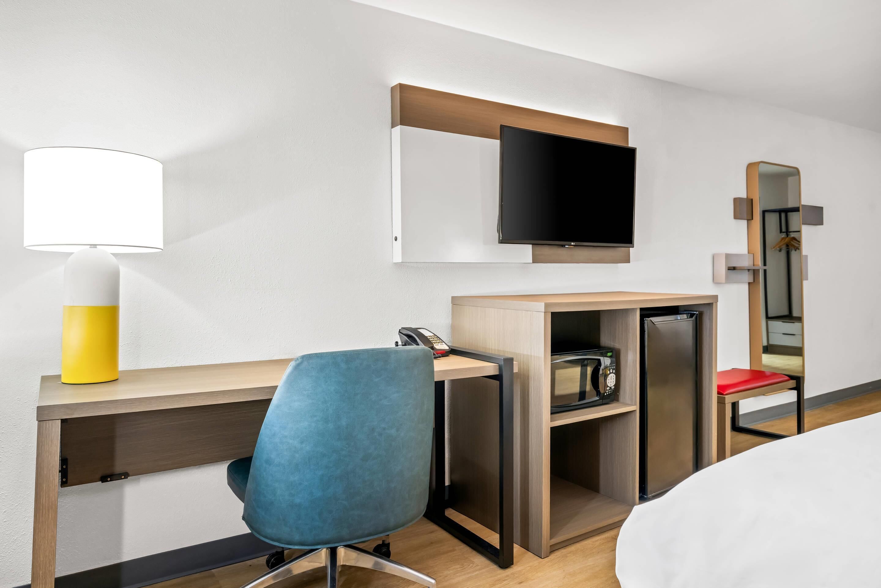 Premium bedding, memory-foam beds, laptop workspace, blackout curtains