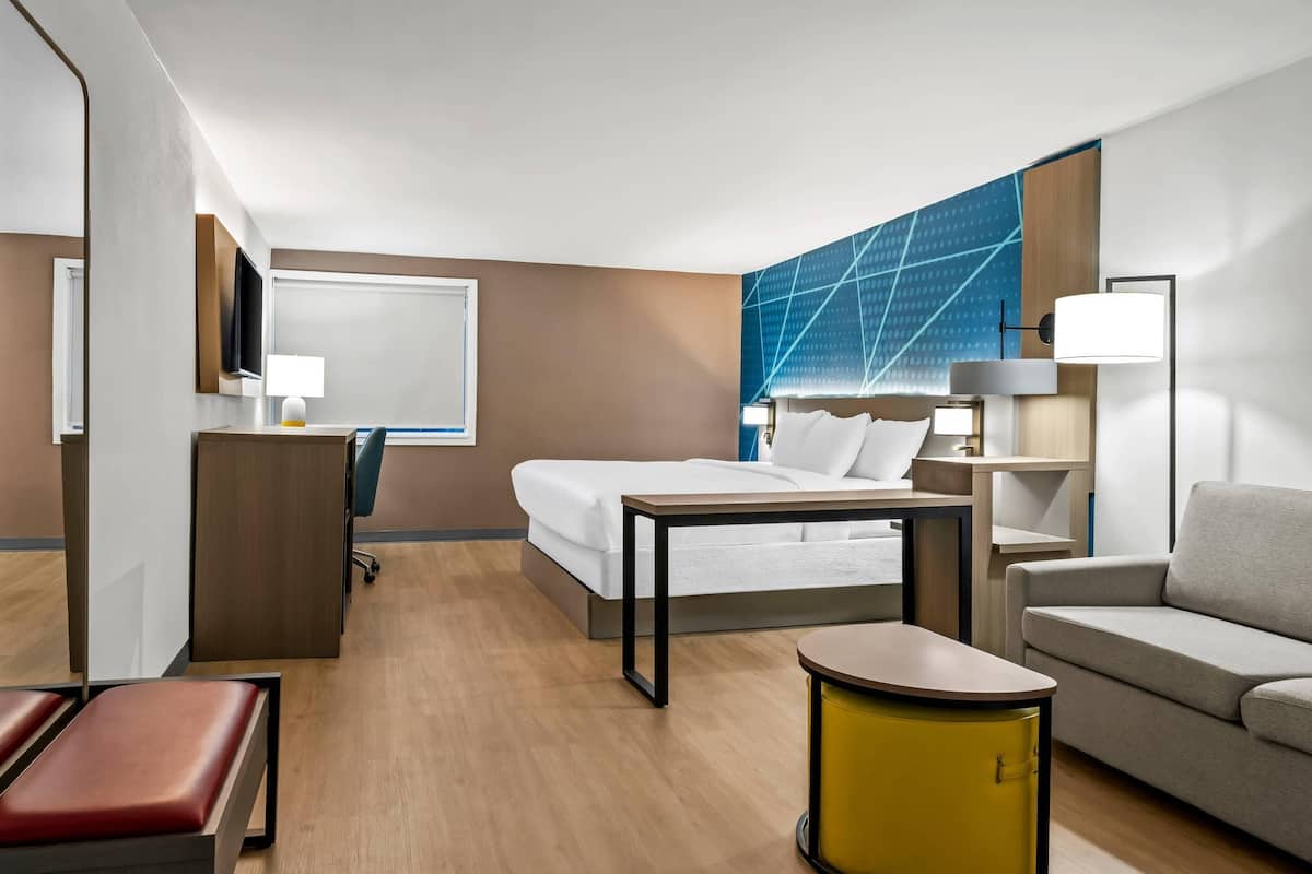 Premium bedding, memory foam beds, laptop workspace, blackout drapes