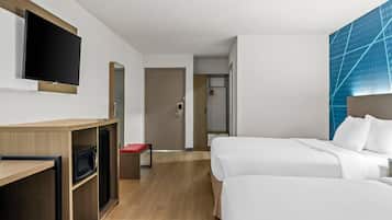 Premium bedding, memory-foam beds, laptop workspace, blackout curtains