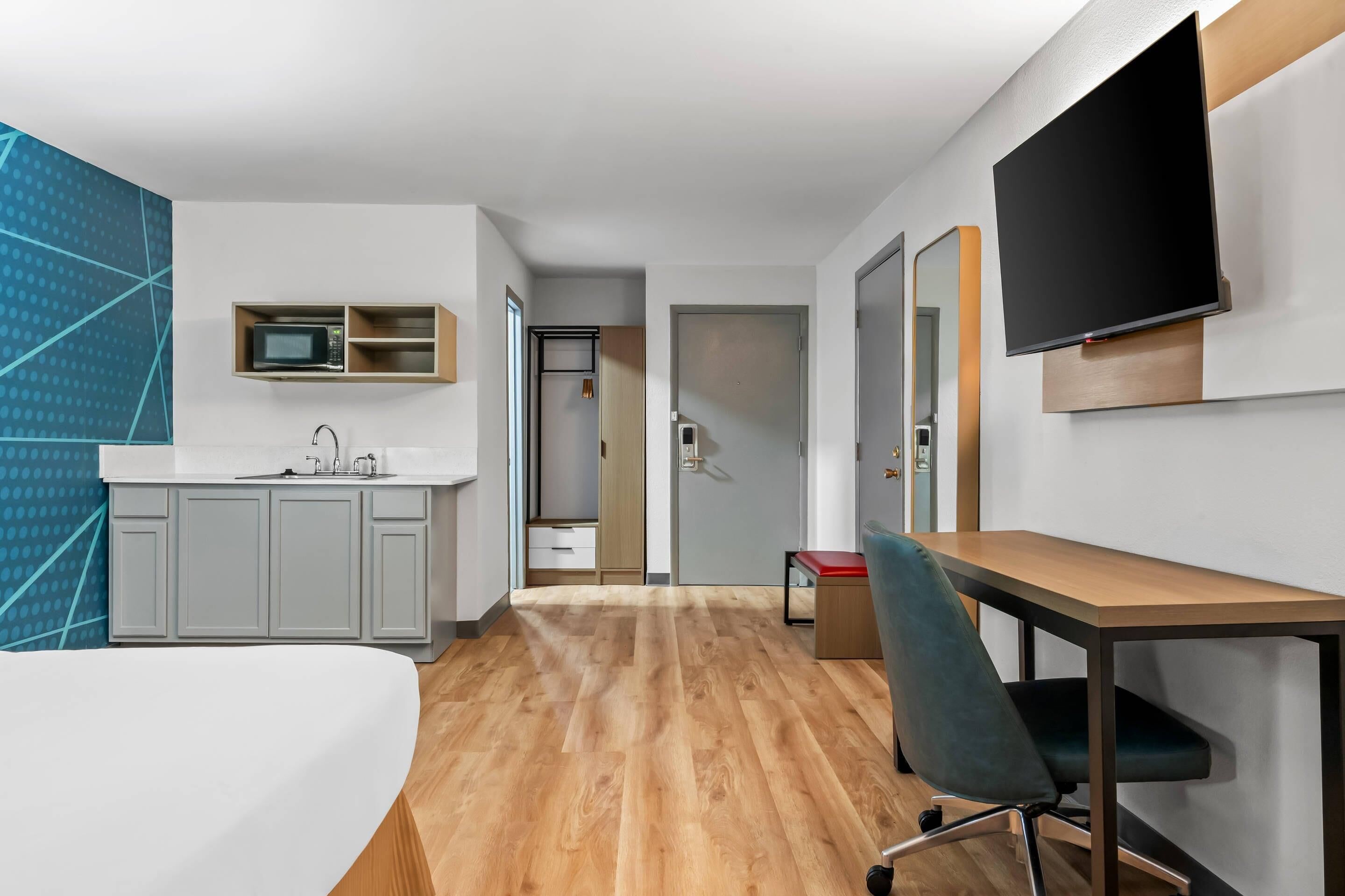 Premium bedding, memory-foam beds, laptop workspace, blackout curtains