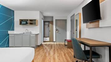 Premium bedding, memory-foam beds, laptop workspace, blackout curtains