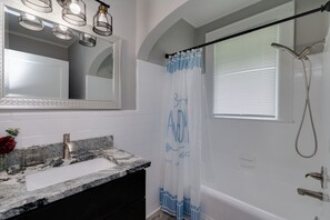 Combined shower/tub, hair dryer, towels, soap