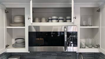 Microwave, dishwasher, coffee/tea maker, cookware/dishes/utensils