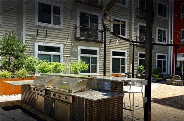 Outdoor kitchen with grill and oven, perfect for al fresco dining.