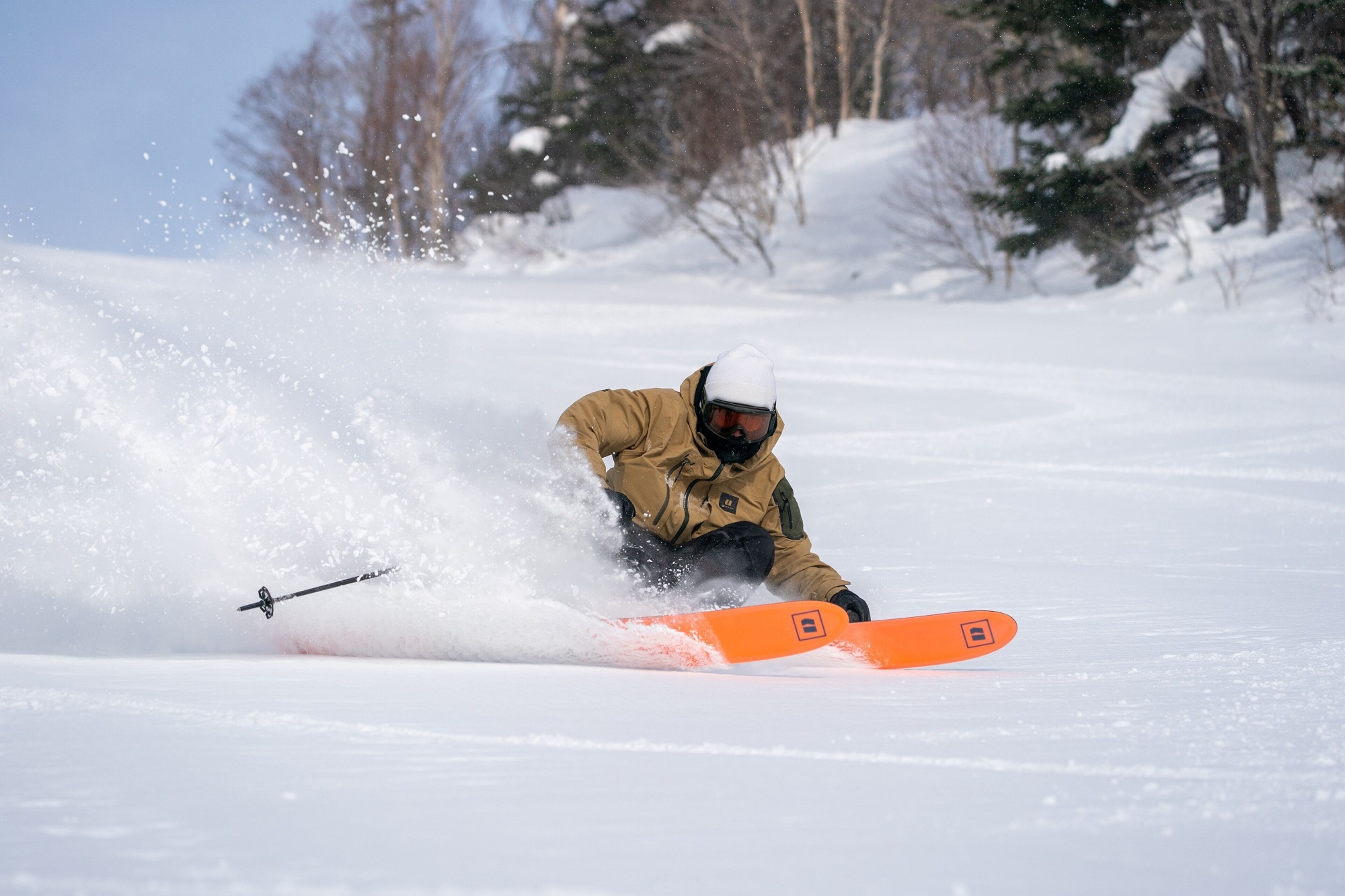 A person snowboarding on a snowy slope.
