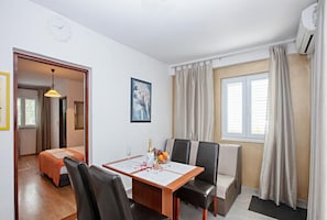 Apartment (One Bedroom Apartment with Terrace) | Private kitchen | Fridge, dining tables