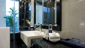 Designer toiletries, hair dryer, bathrobes, slippers