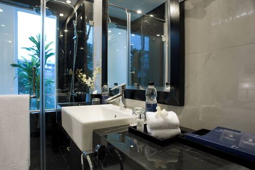 Designer toiletries, hair dryer, bathrobes, slippers