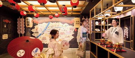 A traditional Japanese setting with red lanterns, a map, and cultural artifacts.