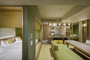 A hotel room with a bed, a small kitchenette, a seating area, and a large mirror. - OMO5 Kyoto Gion by Hoshino Resorts (Kyoto)