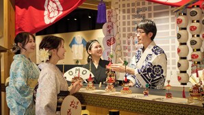 A traditional Japanese setting with a man in a kimono serving food to guests. - OMO5 Kyoto Sanjo by Hoshino Resorts (Kyoto)