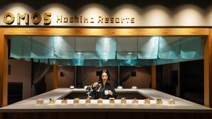 A dessert display at Omos Shingo Resorts with a person presenting the desserts. - OMO5 Kyoto Sanjo by Hoshino Resorts (Kyoto)