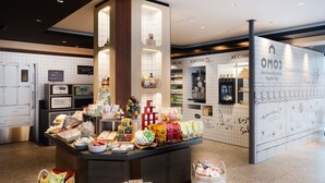 A food and drink station with various packaged goods and beverages. - OMO3 Kyoto Toji by Hoshino Resorts (Kyoto)