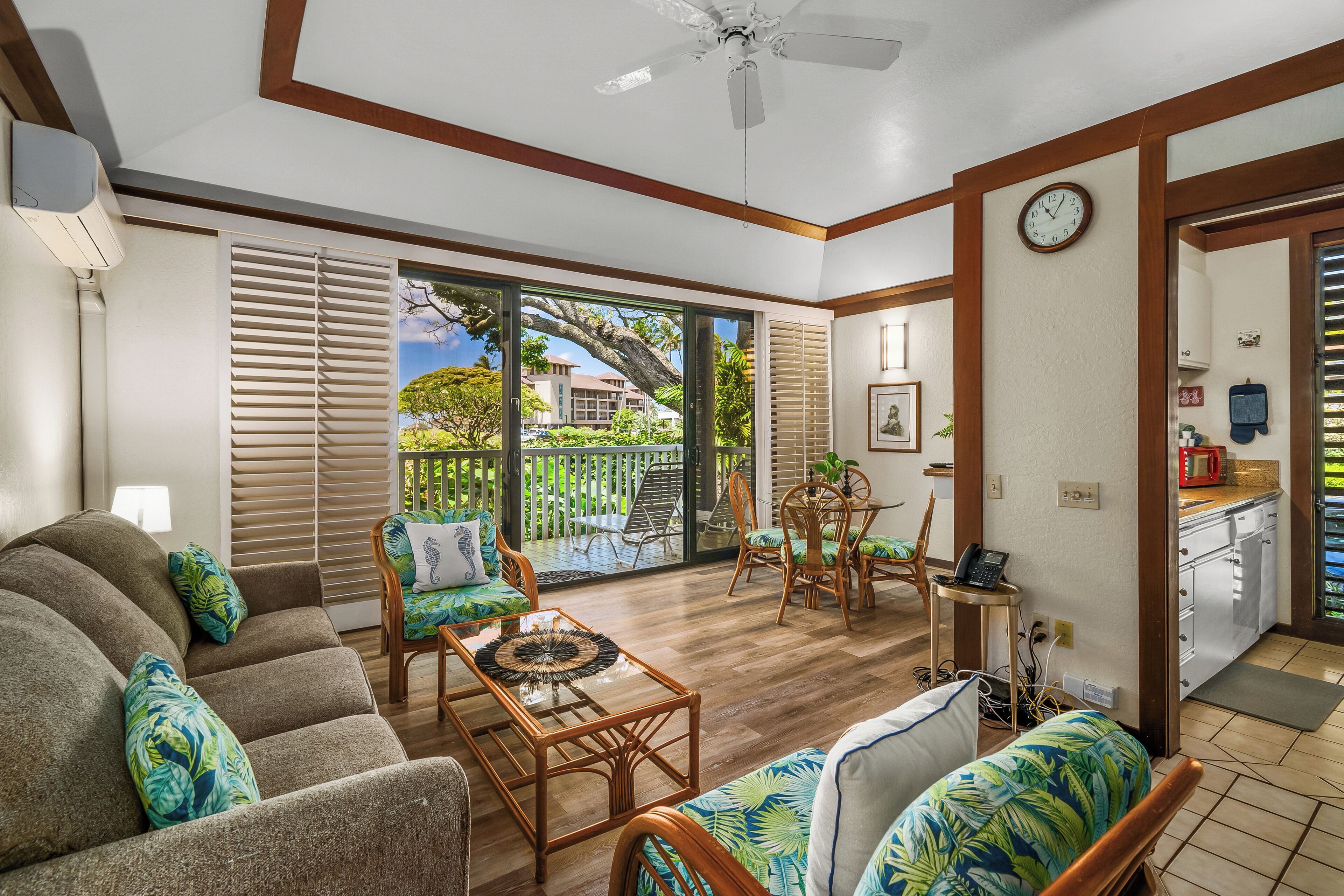 Living Room to Lanai-In a cozy nook where sunlight streams, a tranquil space holds whispered dreams.