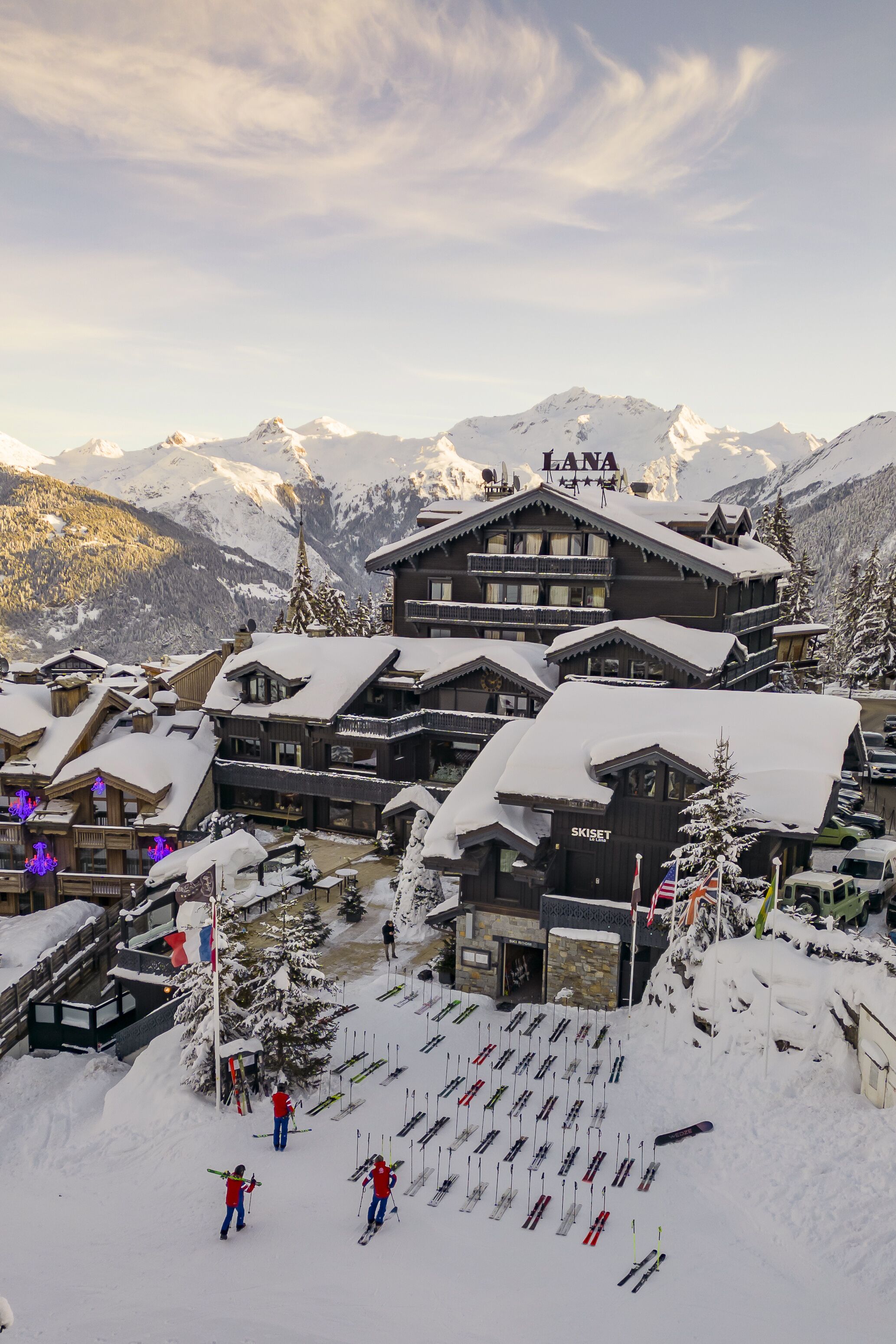 A snow-covered ski resort with multiple buildings, including a prominent lodge named "LANA."