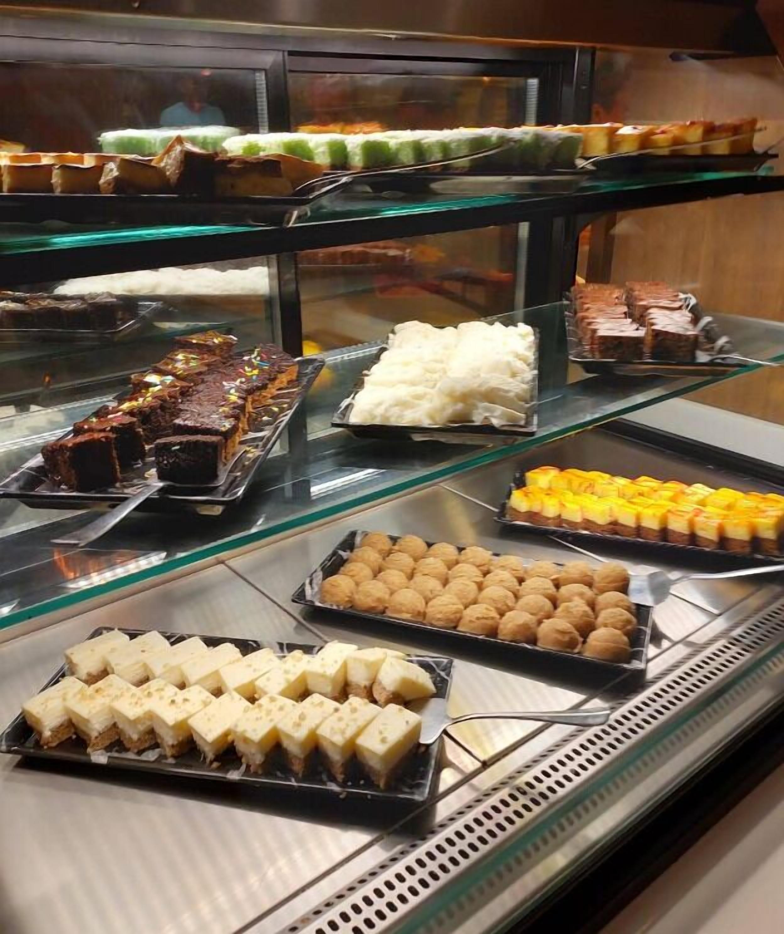 A display case with various desserts.