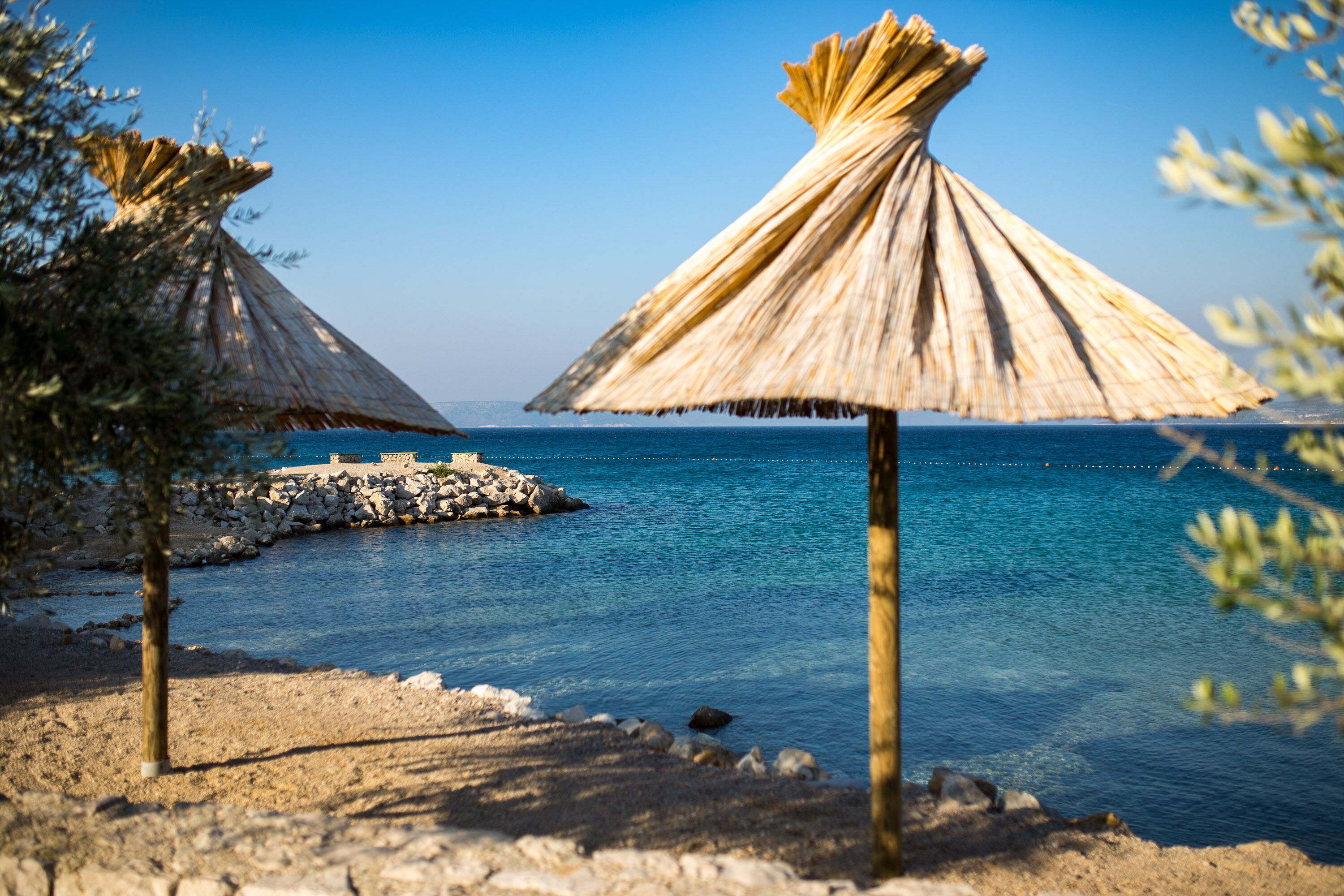 On the beach, sun-loungers