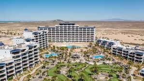 A large resort with multiple buildings, a central pool area, and a golf course. - Casa Blanca Golf Villas 2 Bedrooms Condo E 212 (Puerto Peñasco)