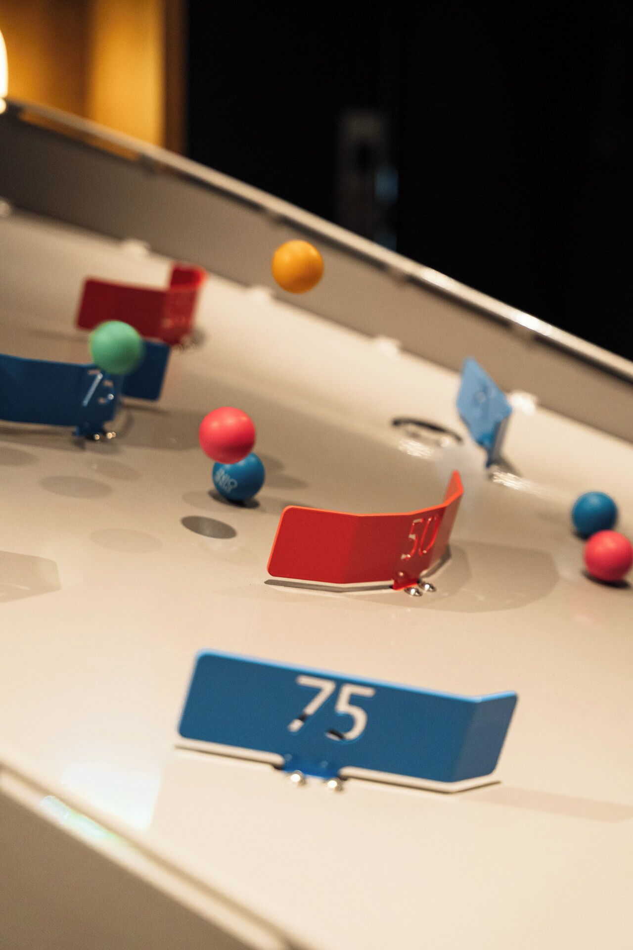 A pool table with numbered pockets and colorful balls.