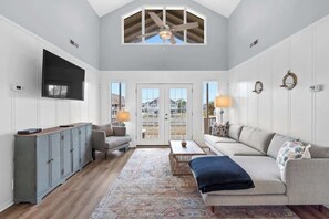 TV, offices - Isle Of A Time by Brunswick Vacation Rentals: Canal Front with Boat Slip (Ocean Isle Beach)