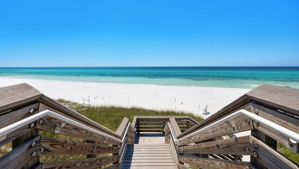 A wooden staircase leading to a beach with clear turquoise water and white sand. - Wine Down- 300 yards to the Beach- Overlooking Community Pool- 2 Bikes (Santa Rosa Beach)
