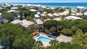 A resort with multiple buildings, a swimming pool, and a view of the ocean. - Wine Down- 300 yards to the Beach- Overlooking Community Pool- 2 Bikes (Santa Rosa Beach)