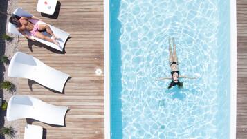 Seasonal outdoor pool, open 9:30 AM to 7:30 PM, pool umbrellas