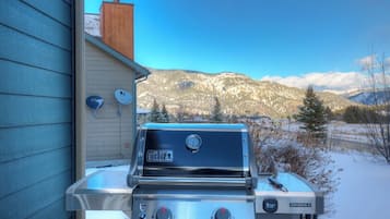 Enjoy al fresco dining with a Weber gas grill, perfect for outdoor cooking.