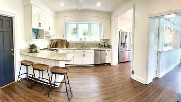 Microwave, dishwasher, coffee/tea maker, cookware/dishes/utensils