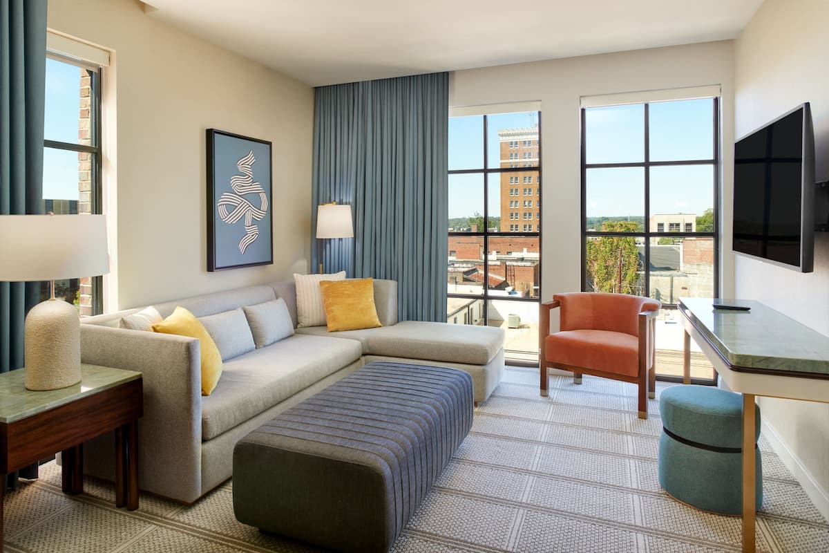 Suite, 1 Bedroom, Corner | Living room | 55-inch flat-screen TV with cable channels, TV, Netflix