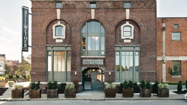 A brick building with the name "The Bellwether" on the facade.
