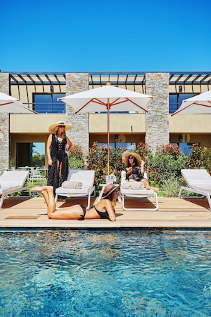 Seasonal outdoor pool, open 8:00 AM to midnight, pool umbrellas