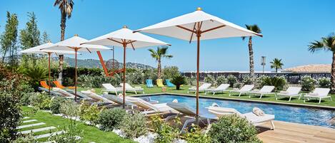 Seasonal outdoor pool, open 8:00 AM to midnight, pool umbrellas