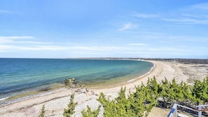 Enjoy breathtaking views of the sea and sandy beach from this coastal retreat.