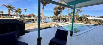 Waterfront 3‑bedroom home with heated pool on a deep sailboat‑access canal. Features EV charging, garage, and stocked kitchen. Near Downtown Punta Gorda, Fisherman’s Village, Isle Yacht Club, and PGD airport.