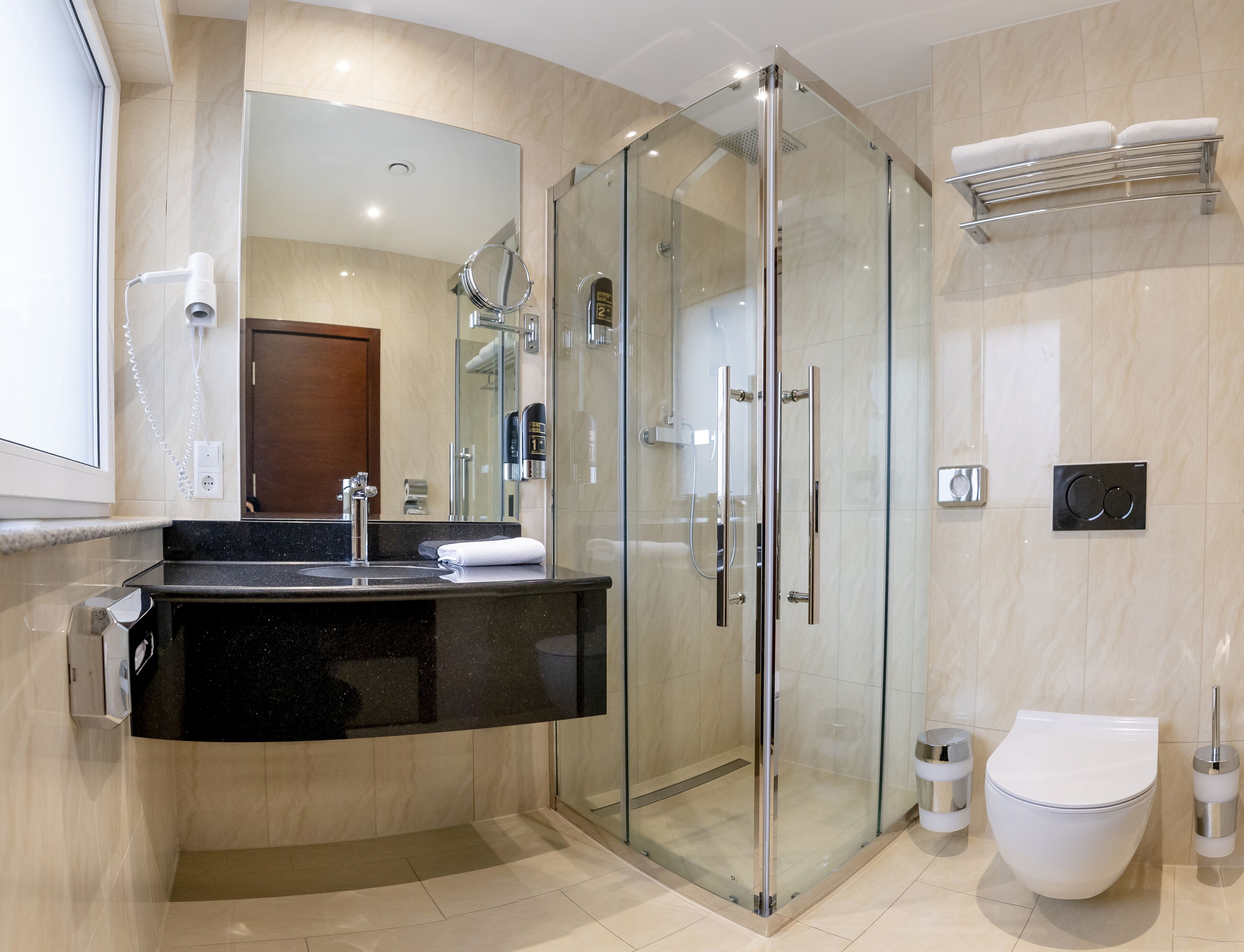 rainfall showerhead, hair dryer, towels, soap