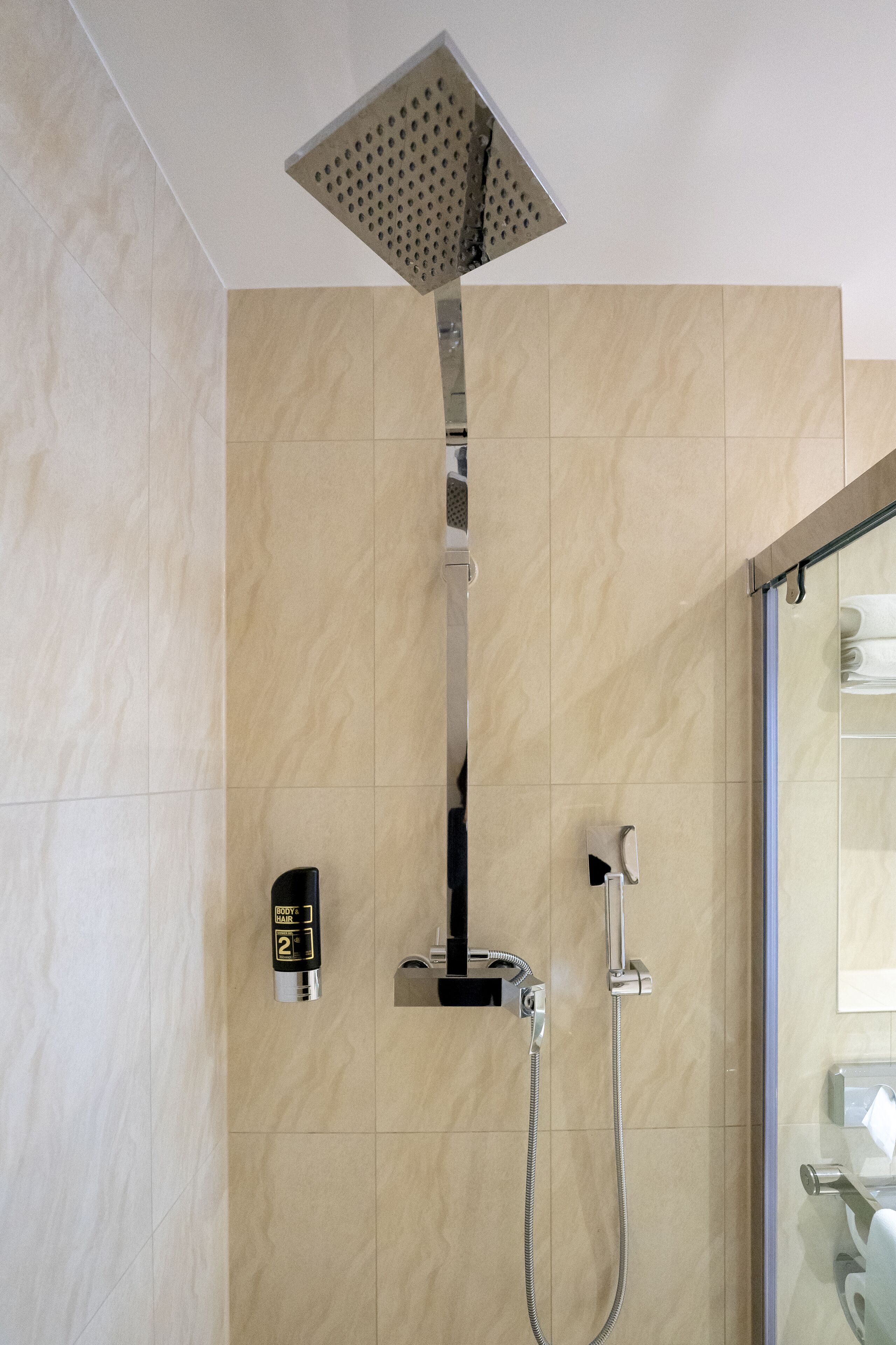 rainfall showerhead, hair dryer, towels, soap