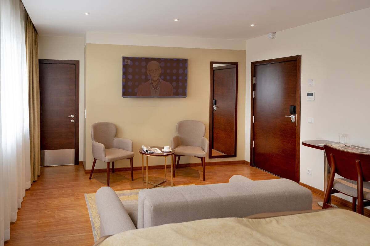 luxury triple room | select comfort beds, in-room safe, desk, laptop workspace