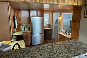 Fridge, microwave, oven, stovetop - Lake-view townhome at Samoset with pools, beach, WiFi, & AC (Gilford)