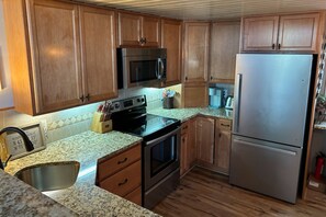 Fridge, microwave, oven, stovetop - Lake-view townhome at Samoset with pools, beach, WiFi, & AC (Gilford)
